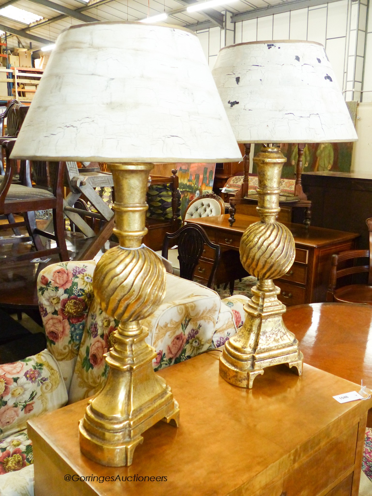 A pair of Italian style gilt table lamps and shades, H.85cm